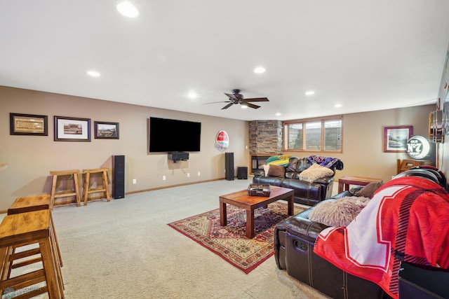 living room featuring carpet and ceiling fan