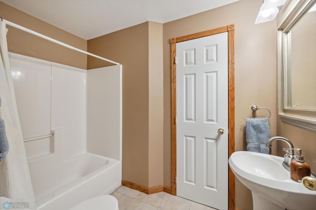 full bathroom with tile patterned flooring, shower / bath combo, toilet, and sink