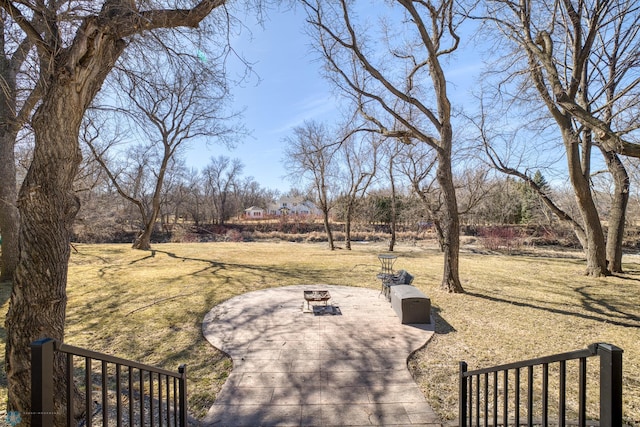 view of yard with a fire pit