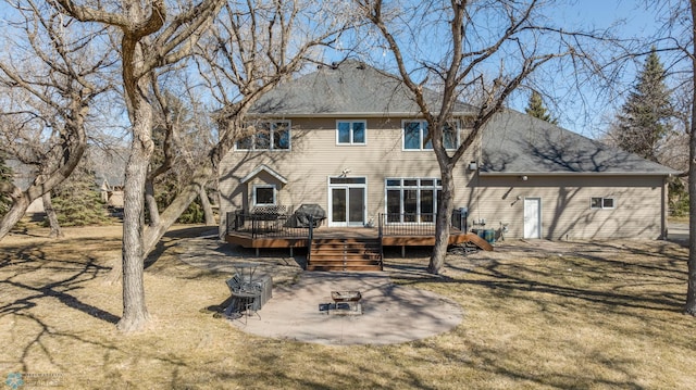 back of house featuring a patio, a deck, and a yard