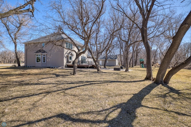 view of yard featuring a wooden deck