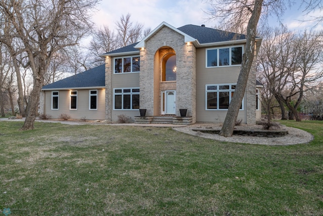 view of front of home with a front lawn