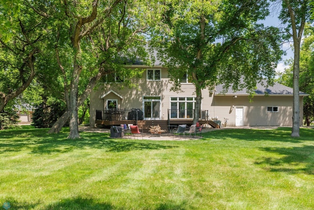 back of property featuring a patio and a yard