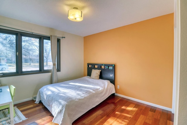 bedroom featuring hardwood / wood-style floors