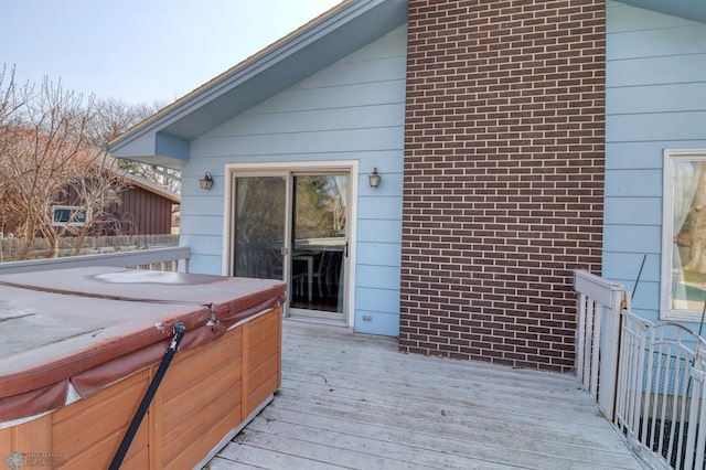 deck featuring a hot tub