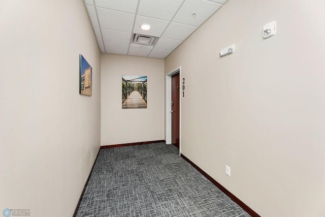 corridor featuring a drop ceiling