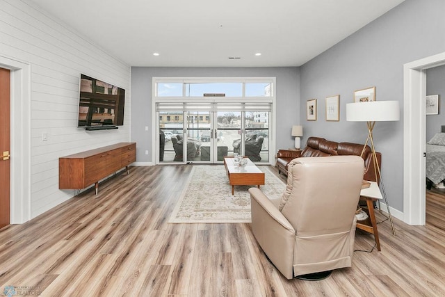 living room with light hardwood / wood-style floors