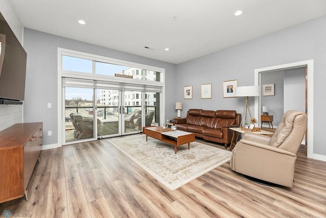 living room with light hardwood / wood-style floors