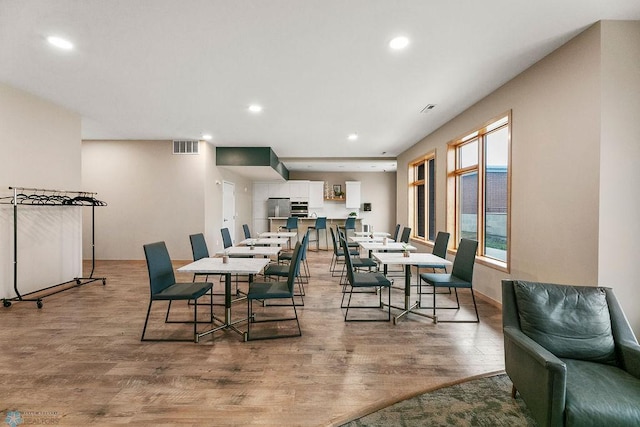 dining space with light wood-type flooring