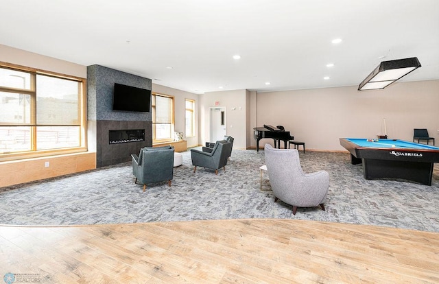 game room featuring plenty of natural light, pool table, and light wood-type flooring