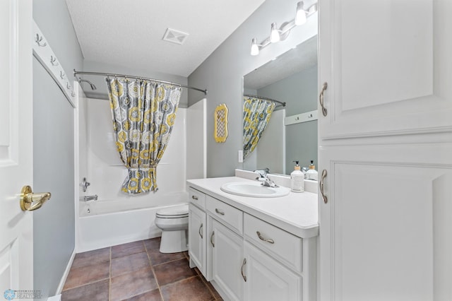 full bathroom with vanity, shower / bath combo with shower curtain, toilet, and a textured ceiling