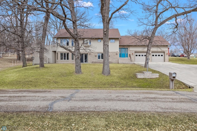 view of front of property with a front lawn and a garage