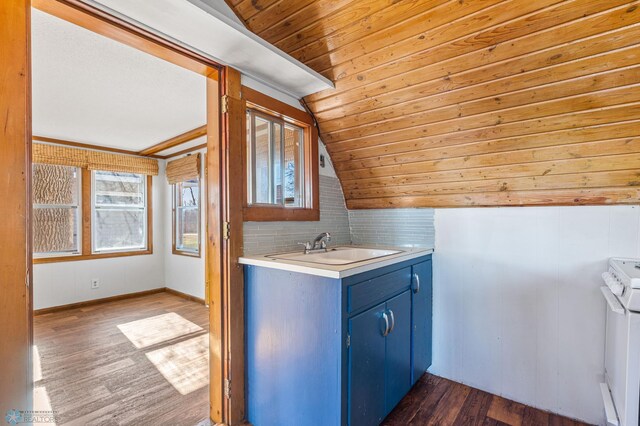 interior space featuring vanity, wooden ceiling, hardwood / wood-style flooring, tasteful backsplash, and lofted ceiling