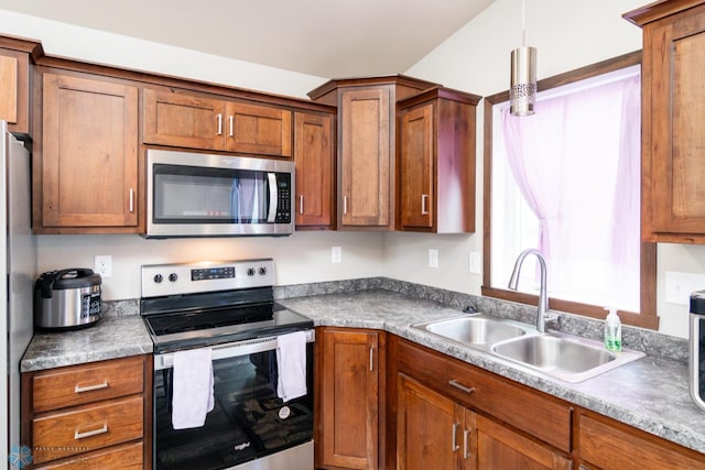 kitchen with sink and appliances with stainless steel finishes