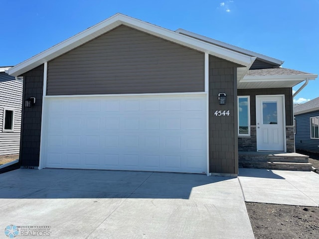 single story home featuring a garage