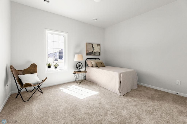 bedroom with light colored carpet