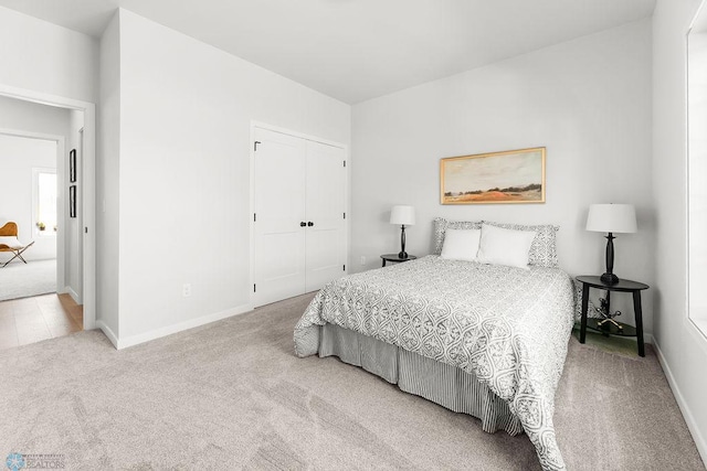 carpeted bedroom featuring a closet