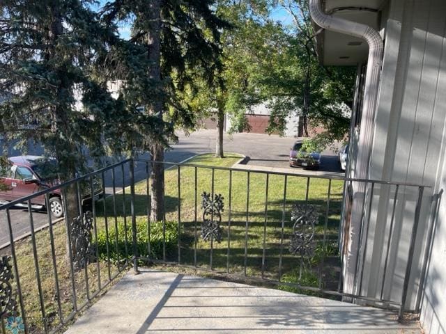 view of gate featuring a yard