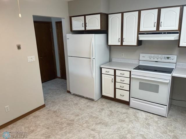 kitchen with white appliances, fume extractor, white cabinetry, and light tile floors