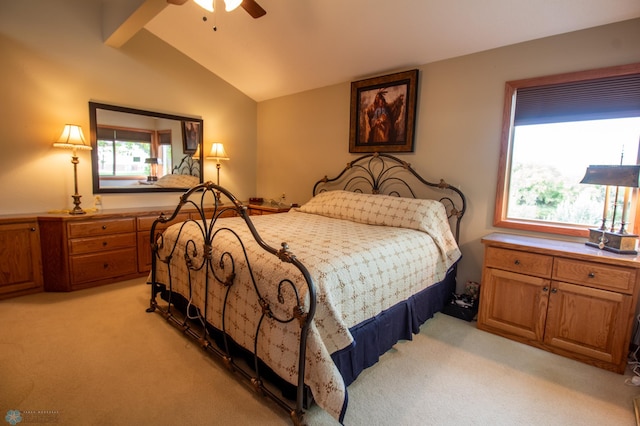 bedroom with light colored carpet, lofted ceiling, multiple windows, and ceiling fan