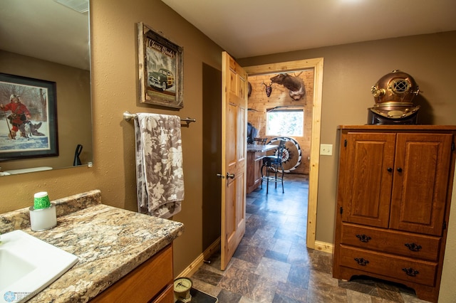 bathroom with vanity and tile flooring