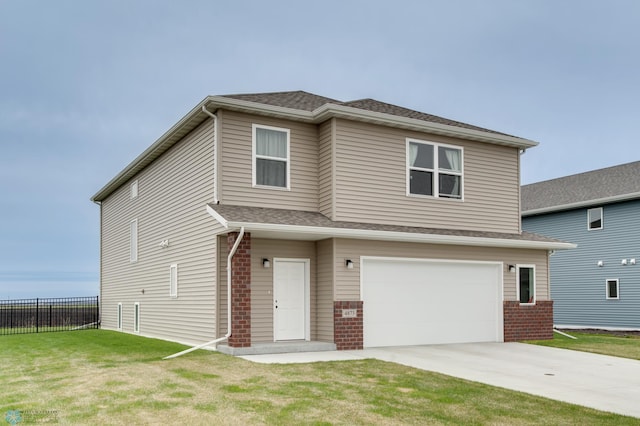 view of front facade featuring a garage and a front yard