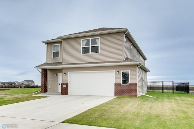 front of property with a front yard and a garage