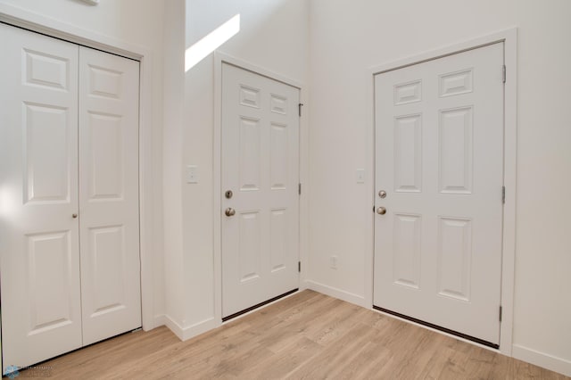 entryway with light hardwood / wood-style flooring