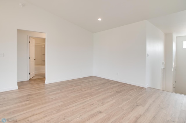 spare room featuring light wood-type flooring