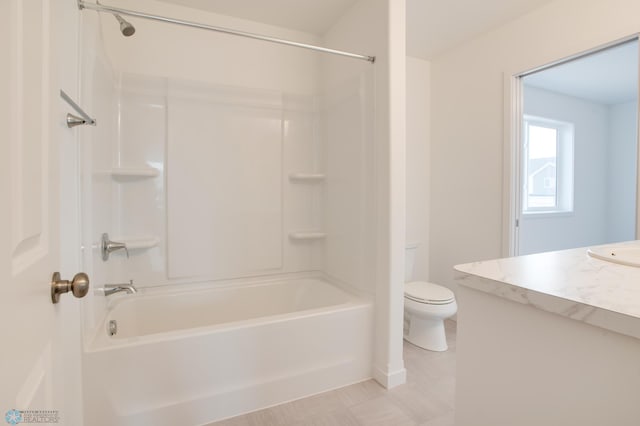 full bathroom featuring toilet, vanity, and shower / bathtub combination