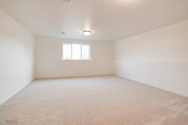 empty room featuring light carpet