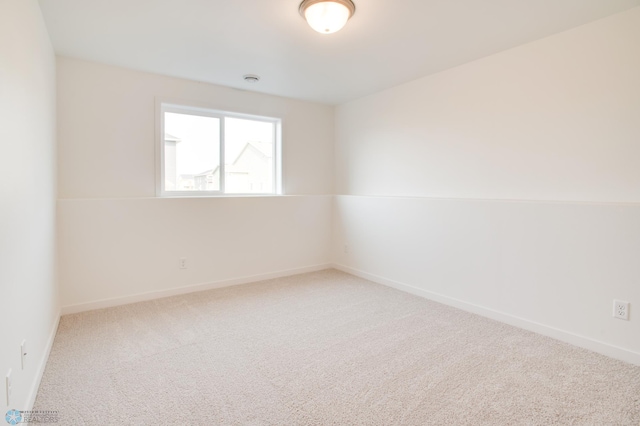 spare room featuring carpet