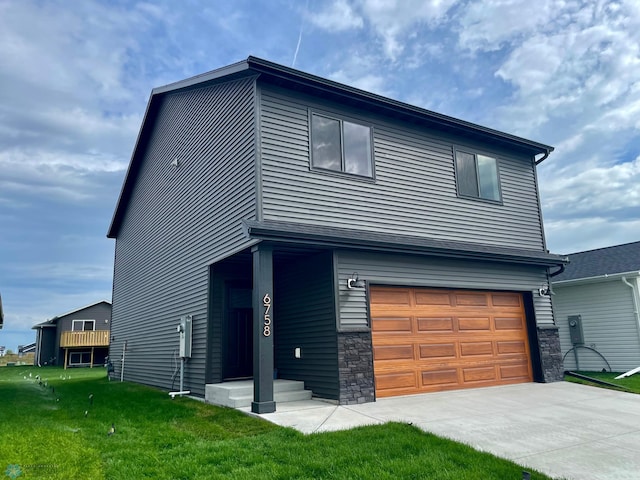 exterior space featuring a front yard and a garage