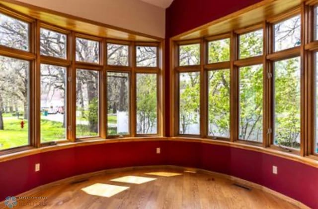 unfurnished sunroom with a healthy amount of sunlight