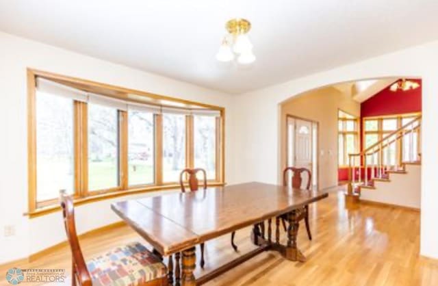 dining space with hardwood / wood-style floors