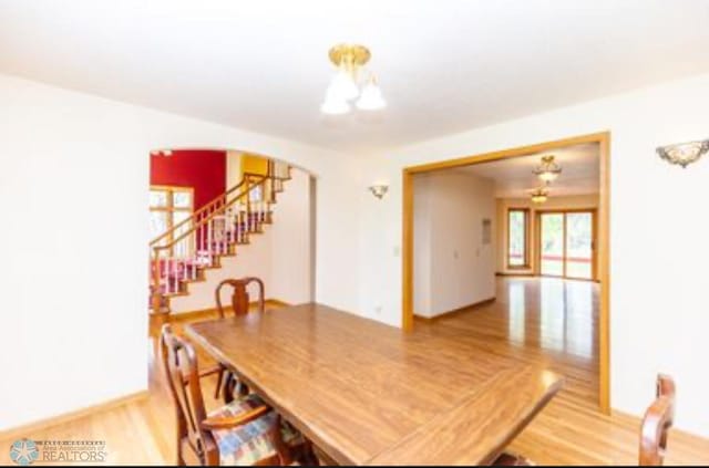 dining area featuring wood-type flooring