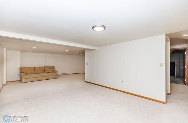 interior space featuring light colored carpet and baseboard heating