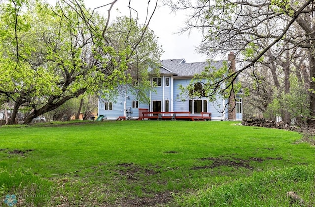 view of yard featuring a wooden deck