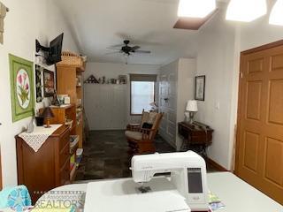 living room featuring ceiling fan