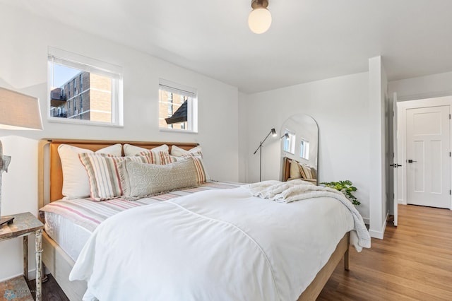 bedroom with hardwood / wood-style floors