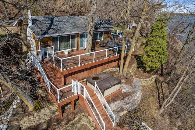 rear view of house with a wooden deck