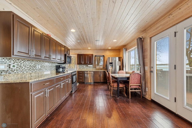 kitchen featuring appliances with stainless steel finishes, wood ceiling, and dark hardwood / wood-style flooring