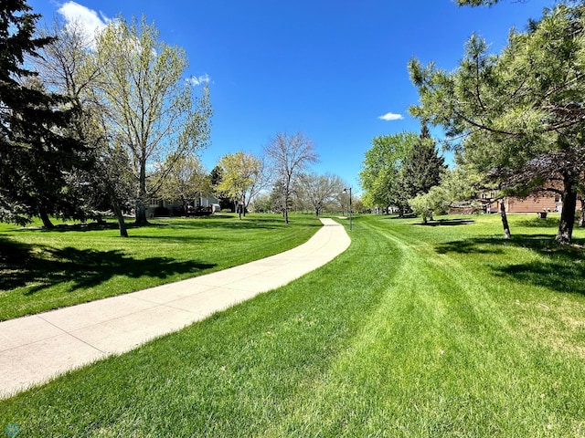 view of home's community featuring a yard