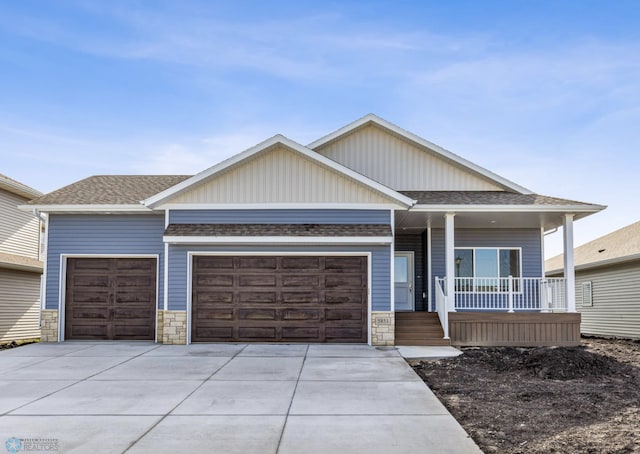 view of front of house featuring a porch and a garage