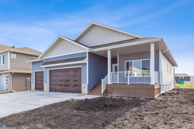 view of front facade with a garage and covered porch