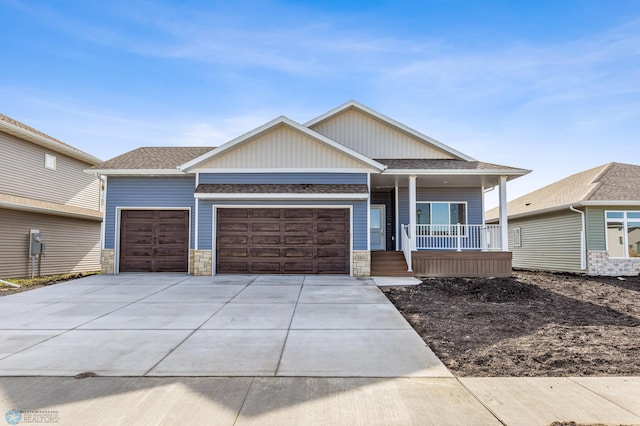 view of front of home featuring a garage and covered porch