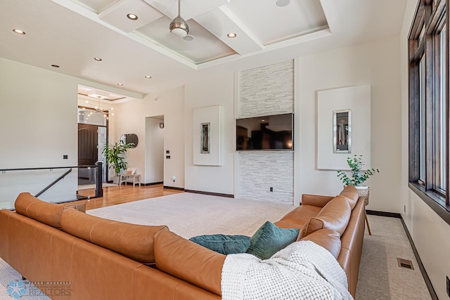 living room featuring coffered ceiling and wood-type flooring