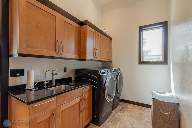 laundry room with sink, light tile flooring, independent washer and dryer, and cabinets