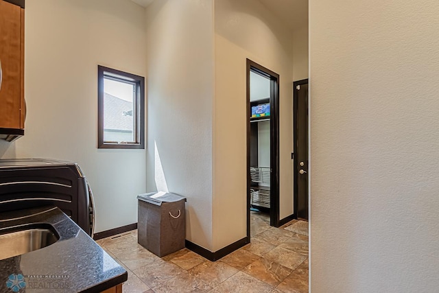 interior space with tile flooring and washer / dryer