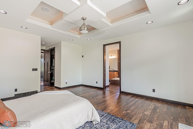 bedroom with coffered ceiling, ensuite bathroom, ceiling fan, and dark wood-type flooring